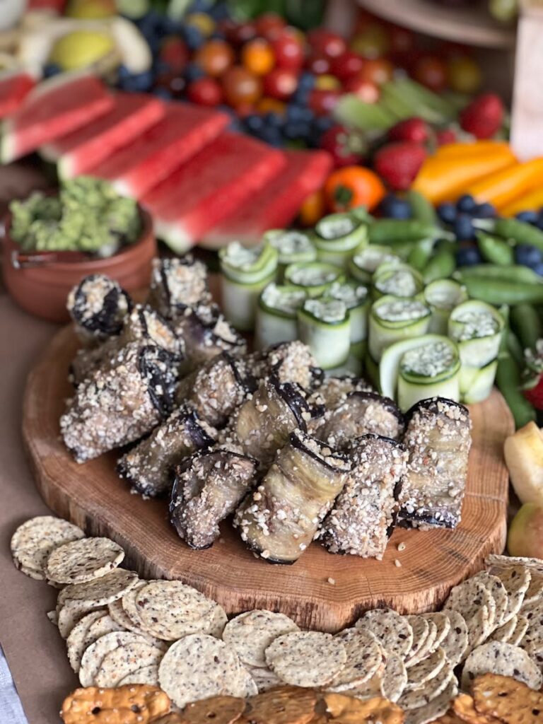 Colorful display of fresh fruits, vegetables, and snacks, perfect for healthy summer gatherings.