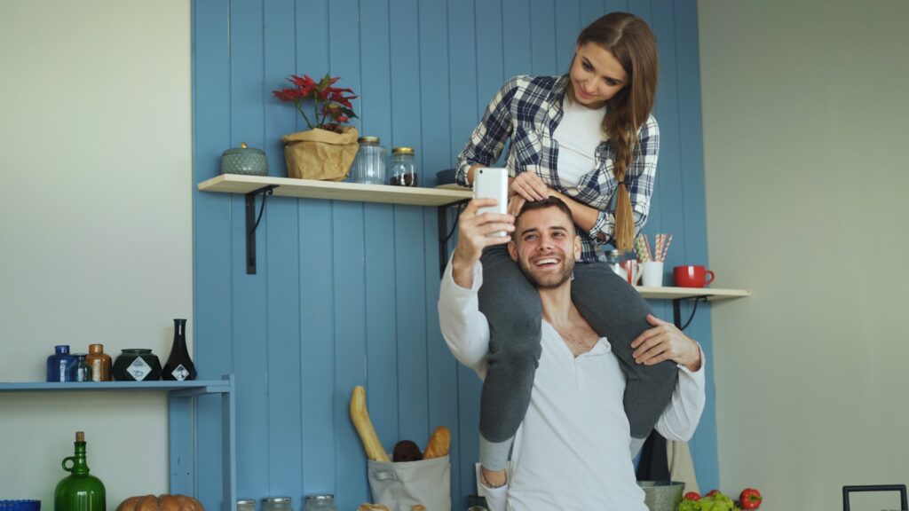 Couple taking a selfie in the kitchen